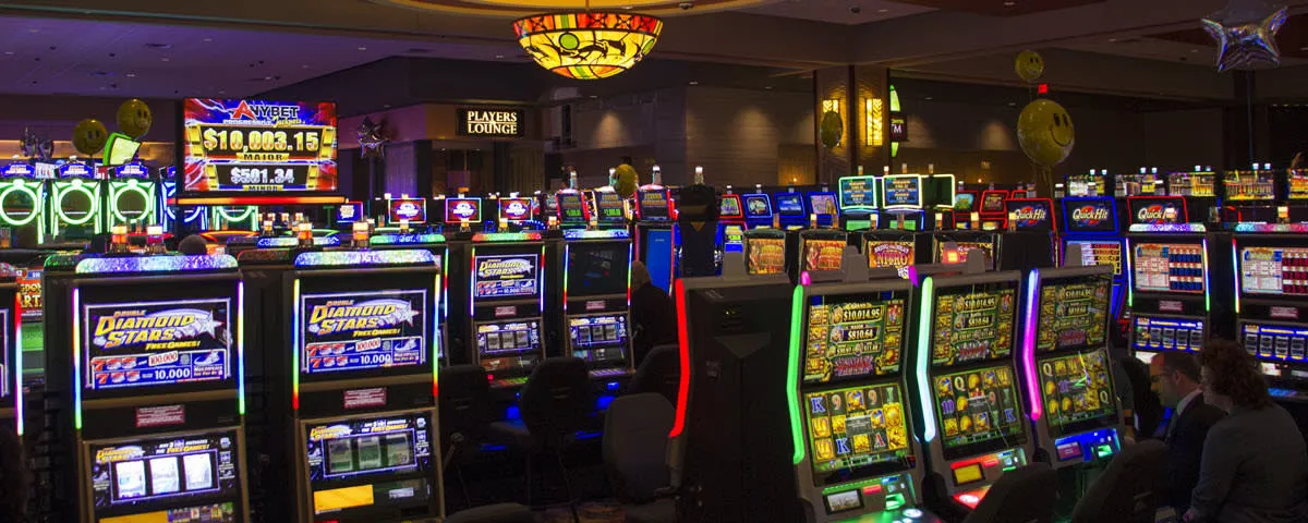 Modern gaming interface shining with victory symbols and golden coin visuals on a sleek dark background.